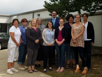 Board members standing in front of strategic retreat venue